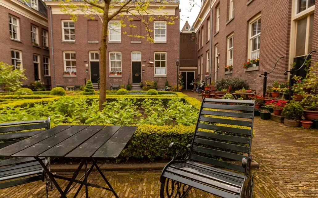 rustic metal chair and table at acourtyard garden in a senior housing community