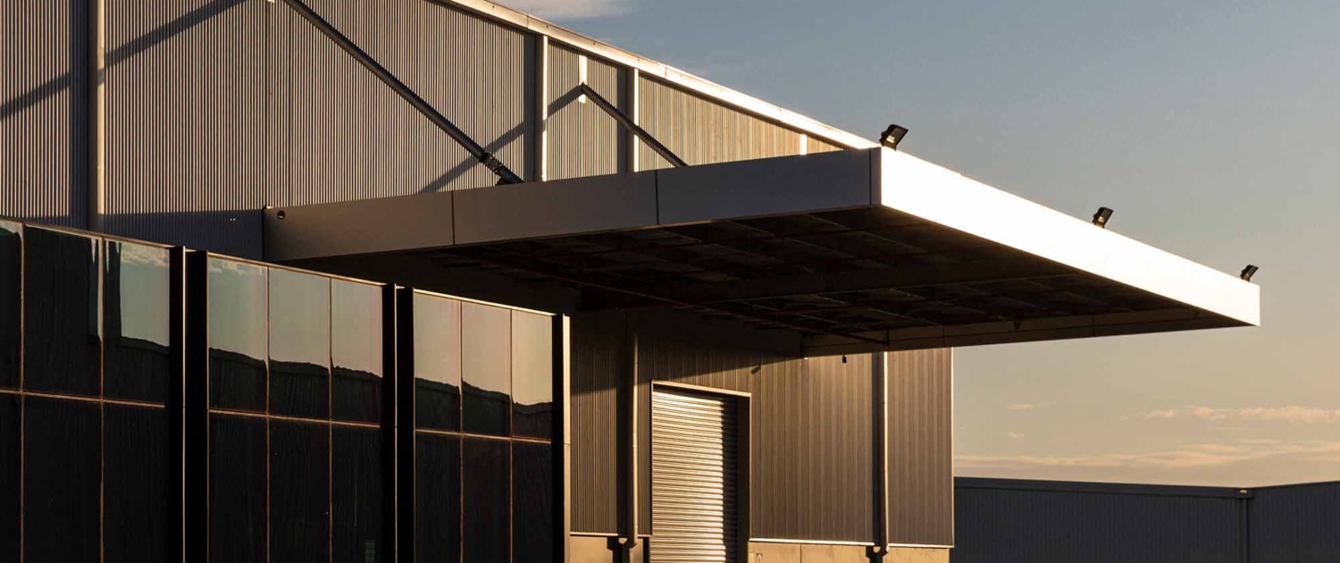 Industrial office & warehouse architecture bathed in afternoon light_