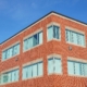 Side view of a red brick commercial building